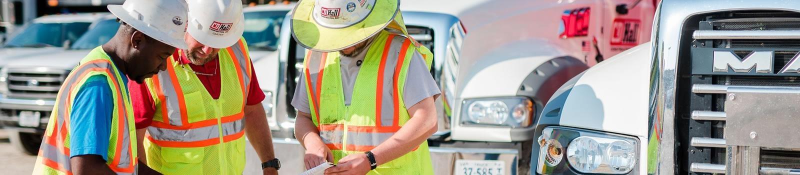 Drivers in Front of CDL Trucks